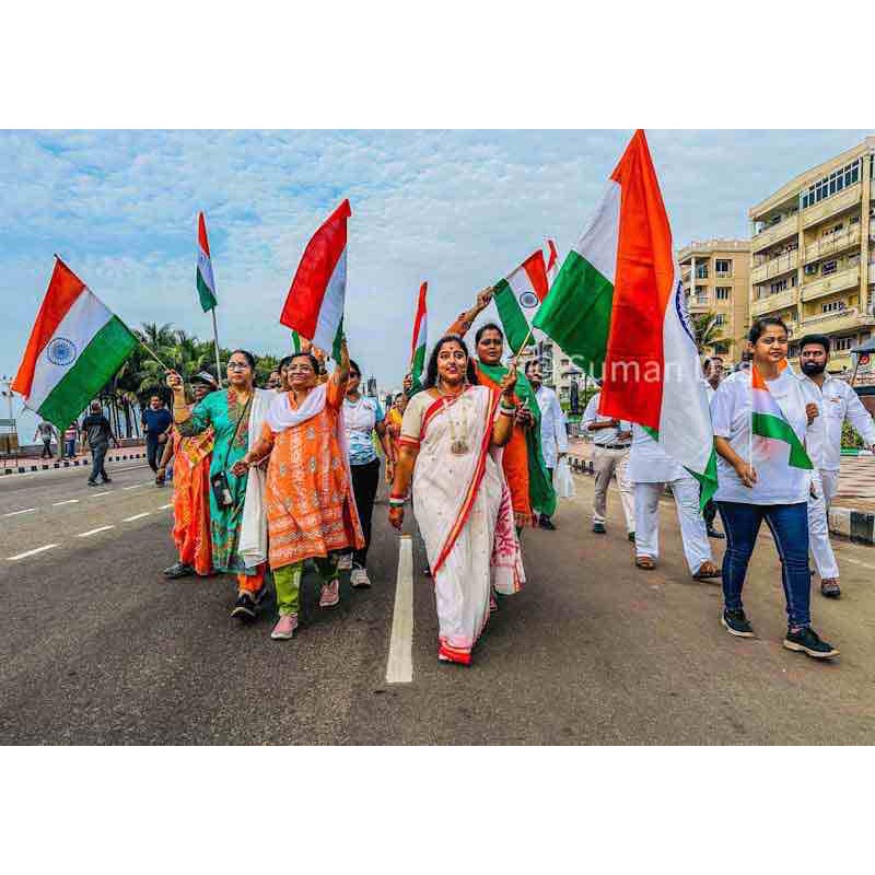 "A diverse group of people joyfully celebrating Independence Day, adorned in a vibrant array of traditional costumes representing India's rich cultural diversity."