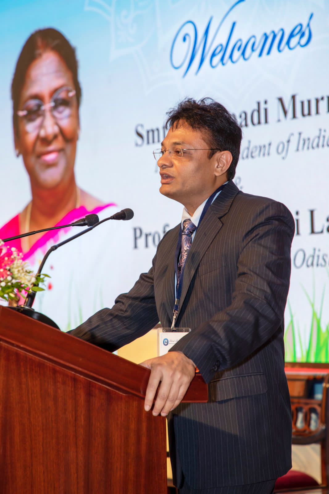 "Photograph of Dr. Suman Das, a sponsor and valued member of the Atut Bandhan family, addressing the gathering on the occasion of the President's meet. Dr. Das shares heartfelt insights and experiences of supporting deserving medical students. #AtutBandhan #InspiringSupport